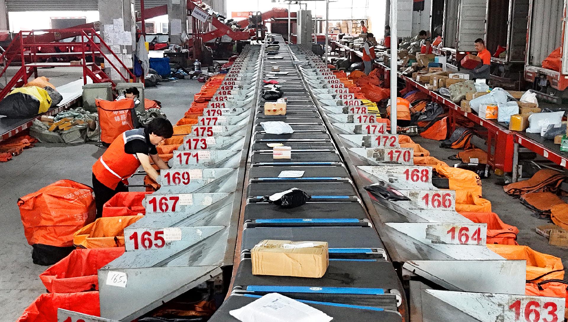 China's express deliveries top 100 billion ahead of last year's pace, signaling steady consumer demand