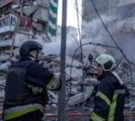 Rescuers search rubble of Kyiv flats after massive Russian strikes kill two