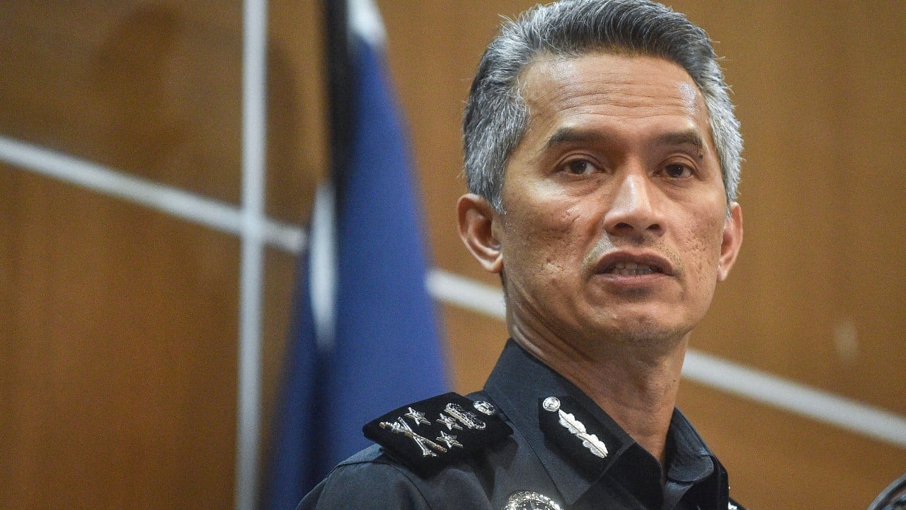 Malaysia’s border chief charged with assaulting police in viral airport clash
