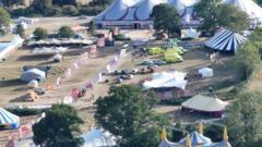 Pastor killed by falling sign at Christian festival named as 'devoted' dad Robert Guanco