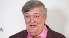 Stephen Fry sues tech conference for up to £100,000 after falling off stage