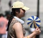 UK heatwave spreads further north and west as temperatures continue to climb