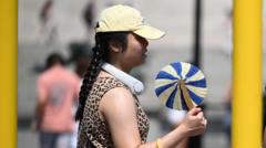 UK heatwave spreads further north and west as temperatures continue to climb