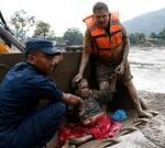 Watch: Rescue teams pull survivors from thick mud