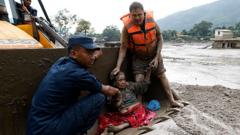Watch: Rescue teams pull survivors from thick mud