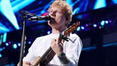 Ed Sheeran asked me to donate $2m in aid, Robert Kraft says after Macklemore backlash