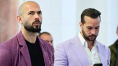 Tate brothers arrested in US as further UK charges take total to 59