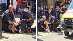 Woman arrested after four stabbed in central London