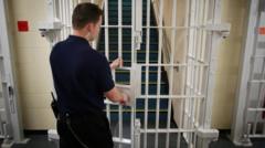 Justice secretary apologises to families affected by early release scheme