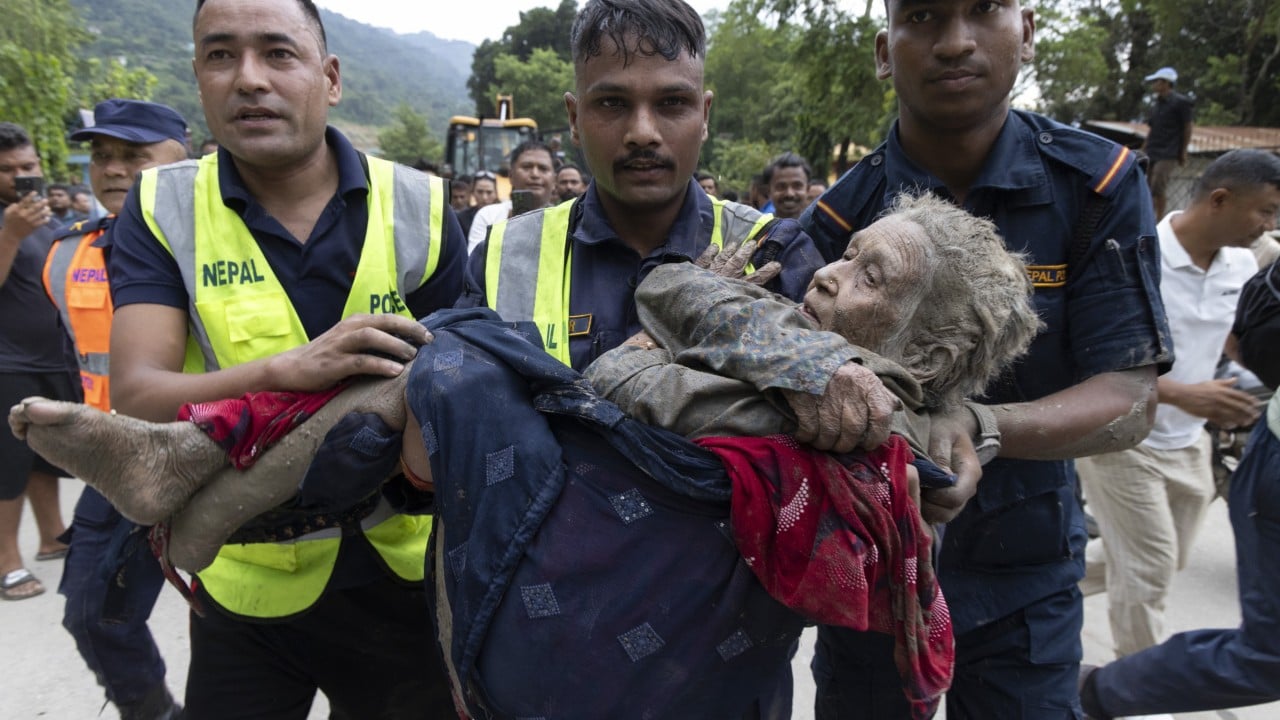 China-Nepal floods: rescuers pull out survivors caked in mud as toll climbs
