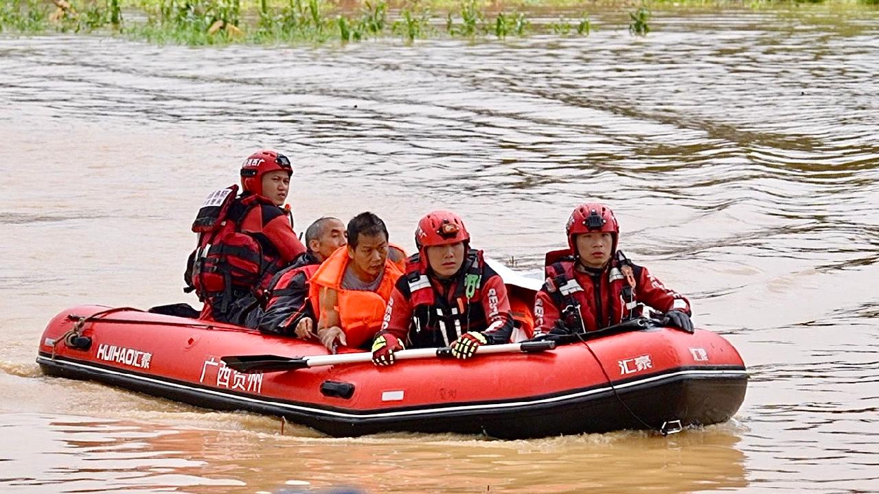 Rescue teams battle floods to save stranded residents