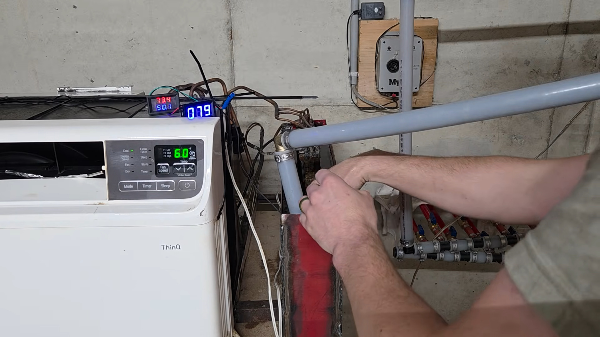 Dumpster-dived Window A/C becomes Ground-Source Heat Pump