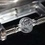 Water-surface vortices drive tiny rotors without electricity, magnets or chemicals