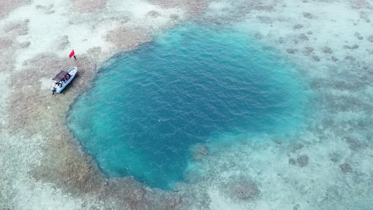 Rare coral reef blue hole found in South China Sea